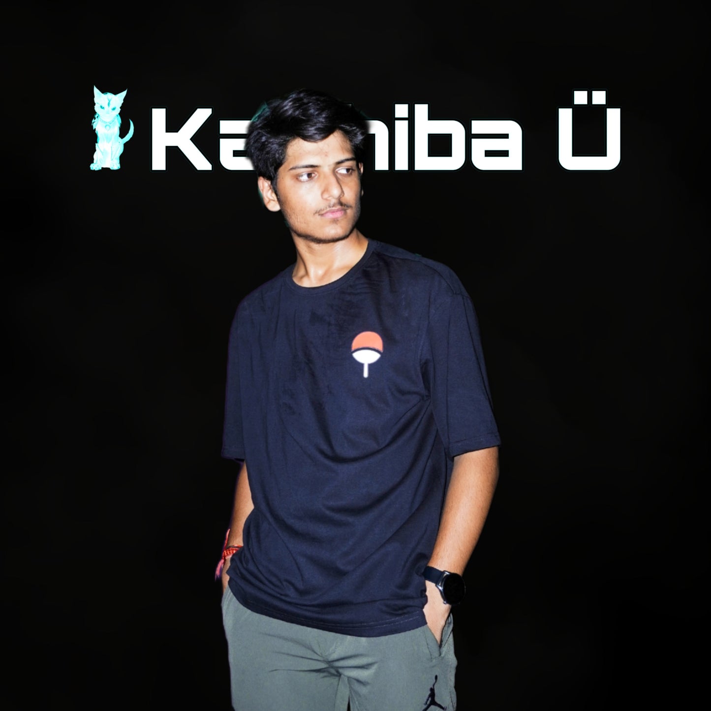 Front view of the model showcasing the premium oversized black t-shirt from Kashiba U with design inspired by Uchiha Logo from the anime Naruto Shippuden. Shop trendy premium t-shirt from Kashiba U online. Buy Now!