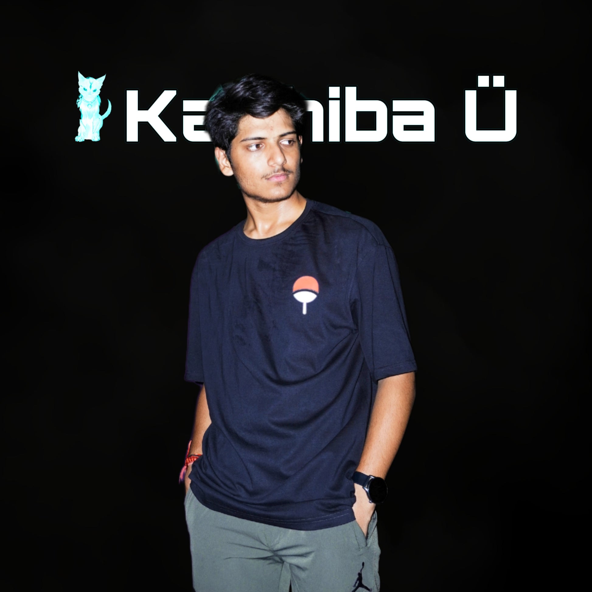 Front view of the model showcasing the premium oversized black t-shirt from Kashiba U with design inspired by Uchiha Logo from the anime Naruto Shippuden. Shop trendy premium t-shirt from Kashiba U online. Buy Now!