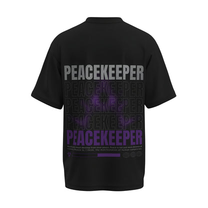 Back view of the premium oversized black t-shirt titled “Peacekeeper” from Kashiba U with cool graphic design inspired by street art printed at the back of the t-shirt. Shop trendy streetwear graphic tee from the website of Kashiba U online. Buy Now!