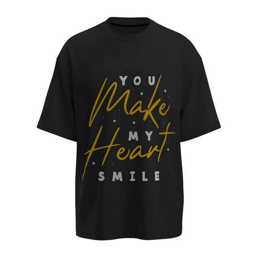 Front view of the premium oversized black t-shirt titled “You Make My Heart Smile” from Kashiba U with cool graphic design inspired by street art printed at the front of the t-shirt. Shop trendy streetwear graphic tee from the website of Kashiba U online. Buy Now!